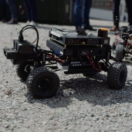 Small robotic cars on the ground