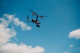 DJI Inspire 2 quadcopter drone against blue sky aerial flight and filming